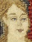 Use top stitching to bring out the detail in a needlepoint face.